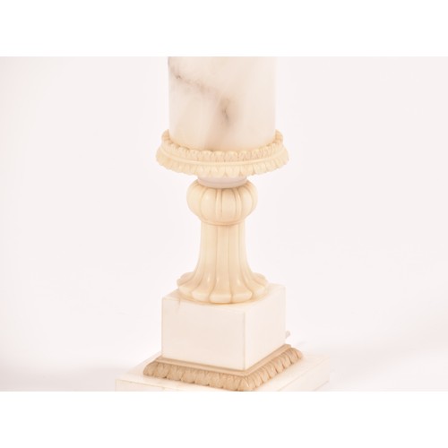 245 - A large alabaster and marble table lamp with shade, of urn form and supported on a fluted stem to a ... 