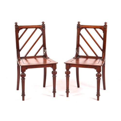 285 - A pair of Victorian mahogany Gothic style hall chairs, the backs with diagonal rails and turned fini... 