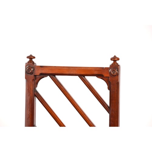 285 - A pair of Victorian mahogany Gothic style hall chairs, the backs with diagonal rails and turned fini... 