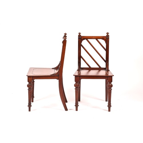 285 - A pair of Victorian mahogany Gothic style hall chairs, the backs with diagonal rails and turned fini... 