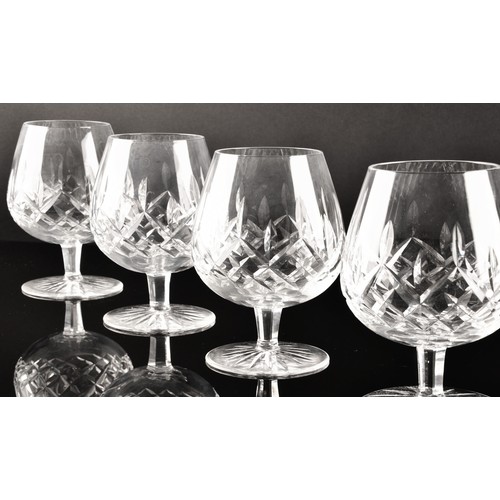 274 - A collection of Waterford cut crystal glasses, including six wine glasses, six champagne flutes, fou... 