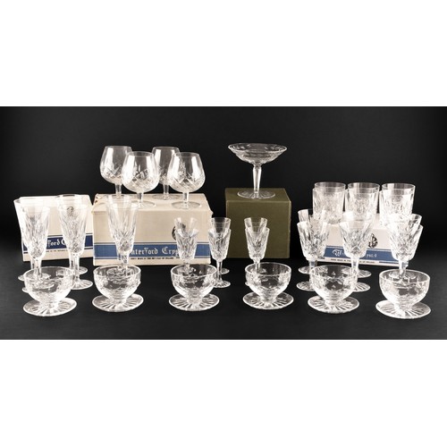 274 - A collection of Waterford cut crystal glasses, including six wine glasses, six champagne flutes, fou... 