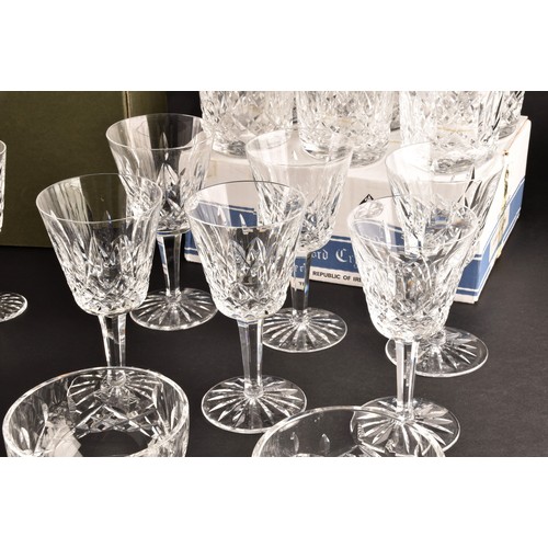 274 - A collection of Waterford cut crystal glasses, including six wine glasses, six champagne flutes, fou... 