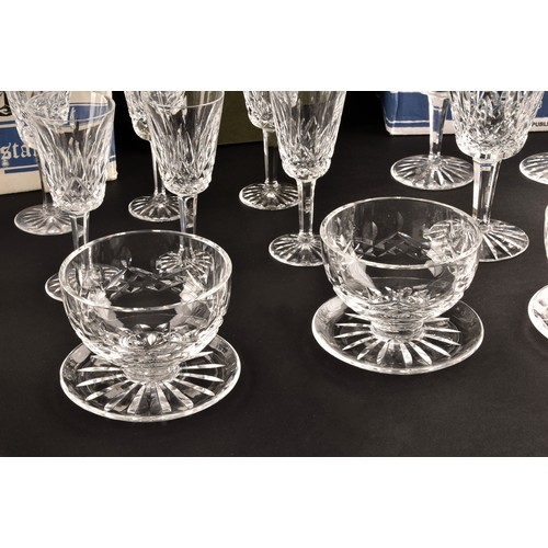 274 - A collection of Waterford cut crystal glasses, including six wine glasses, six champagne flutes, fou... 