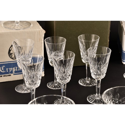 274 - A collection of Waterford cut crystal glasses, including six wine glasses, six champagne flutes, fou... 