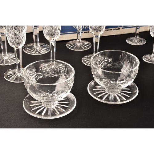 274 - A collection of Waterford cut crystal glasses, including six wine glasses, six champagne flutes, fou... 