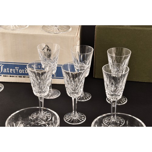 274 - A collection of Waterford cut crystal glasses, including six wine glasses, six champagne flutes, fou... 