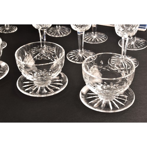 274 - A collection of Waterford cut crystal glasses, including six wine glasses, six champagne flutes, fou... 