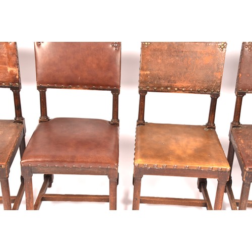 287 - A set of ten Jacobean revival oak and leather dining chairs, with leather studded back rests and sea... 