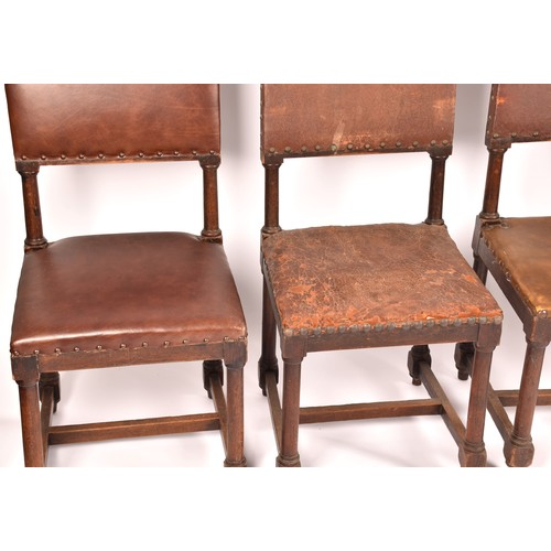 287 - A set of ten Jacobean revival oak and leather dining chairs, with leather studded back rests and sea... 