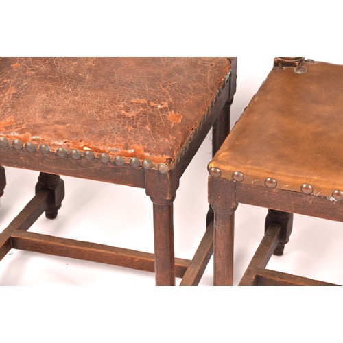 287 - A set of ten Jacobean revival oak and leather dining chairs, with leather studded back rests and sea... 