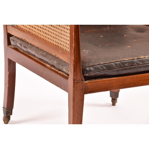 288 - A 19th century mahogany bergere armchair, with mahogany show wood reeded frame, with cane back and s... 