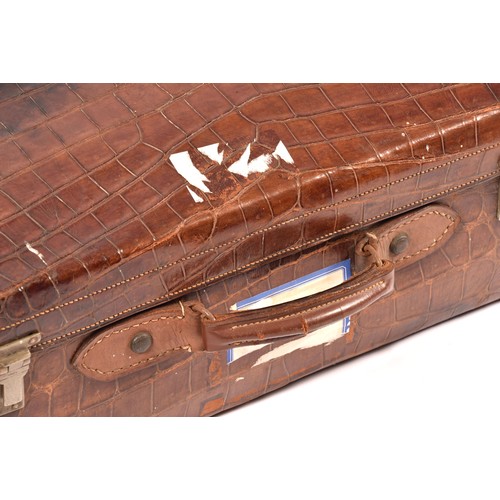 248 - A group of two leather, one alligator skin and one canvas covered suitcases / trunks, the canvas cov... 