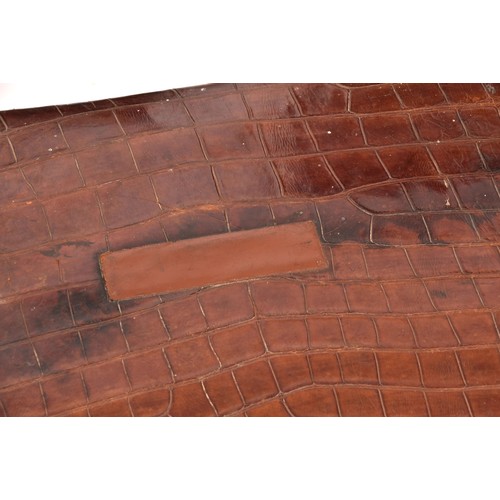 248 - A group of two leather, one alligator skin and one canvas covered suitcases / trunks, the canvas cov... 