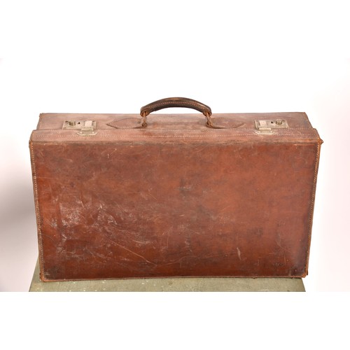 248 - A group of two leather, one alligator skin and one canvas covered suitcases / trunks, the canvas cov... 