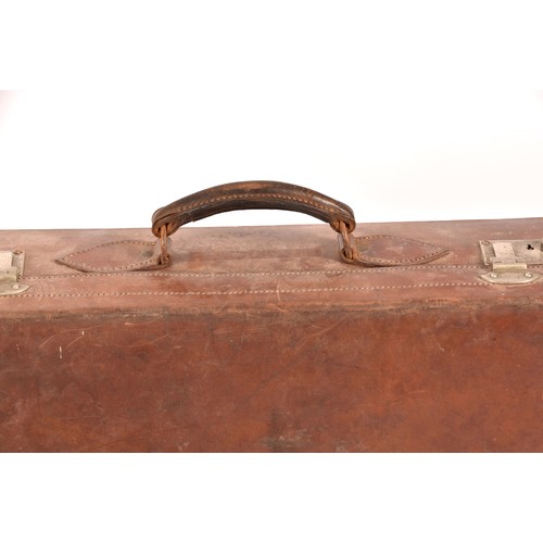 248 - A group of two leather, one alligator skin and one canvas covered suitcases / trunks, the canvas cov... 