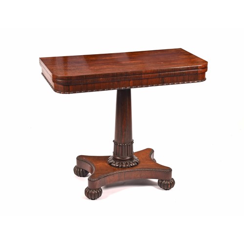 290 - A Regency rosewood foldover card table, the figured top with baize lined interior, supported on a ta... 