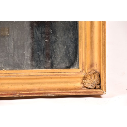 292 - A 19th century gilt framed rectangular wall mirror, the gilt gesso frame with shell mounted corners.... 