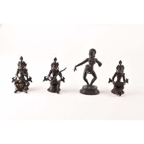 57 - A group of Asian Objet d'art, including a set of three Nepalese bronze figures, an Indian figure of ... 