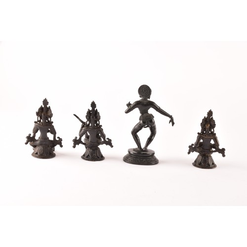 57 - A group of Asian Objet d'art, including a set of three Nepalese bronze figures, an Indian figure of ... 