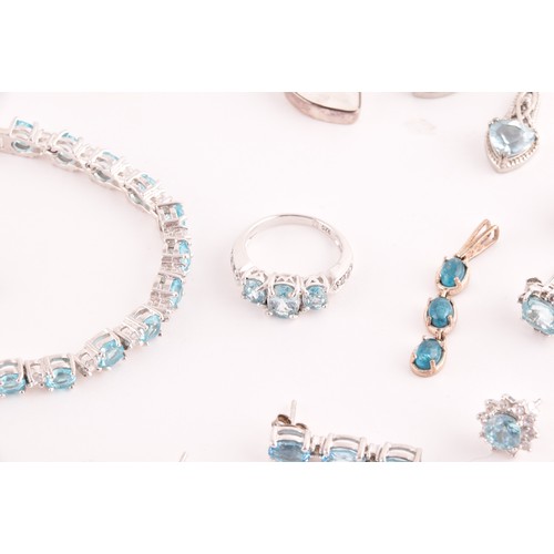 113 - A silver, blue and white topaz line bracelet, together with a silver chain suspended with four silve... 