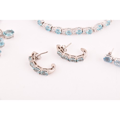 113 - A silver, blue and white topaz line bracelet, together with a silver chain suspended with four silve... 