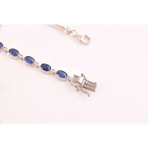 114 - A silver and kyanite line bracelet, collet-set with oval-cut kyanite gemstones, together with a silv... 