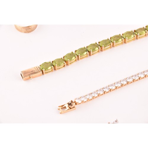 117 - A silver gilt and peridot line bracelet, together with a CZ line bracelet (lacking one stone), a sil... 