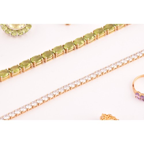 117 - A silver gilt and peridot line bracelet, together with a CZ line bracelet (lacking one stone), a sil... 