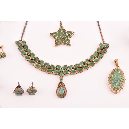 118 - A silver gilt and emerald pendant necklace set with mixed marquise-shaped emeralds, together with a ... 