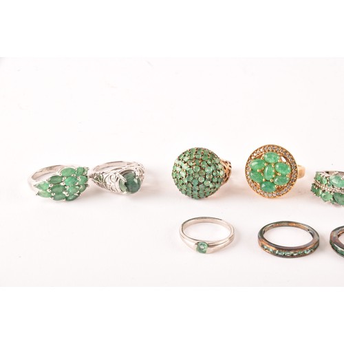 120 - A group of eleven silver and gemstone rings, including a silver and emerald ring set with fourteen m... 