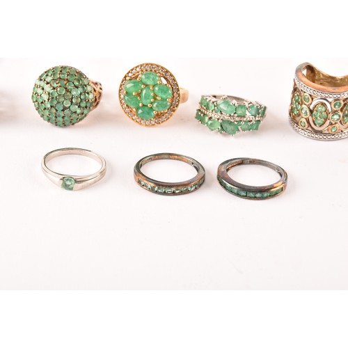 120 - A group of eleven silver and gemstone rings, including a silver and emerald ring set with fourteen m... 