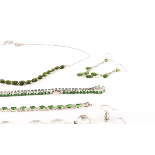 123 - A group of silver and Russian chrome diopside jewellery items, including a line bracelet set with mi... 