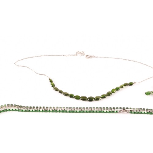 123 - A group of silver and Russian chrome diopside jewellery items, including a line bracelet set with mi... 