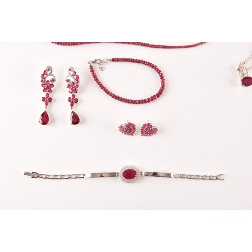 129 - A pair of silver and ruby dress earrings, of elongated articulated design, together with a pair of s... 