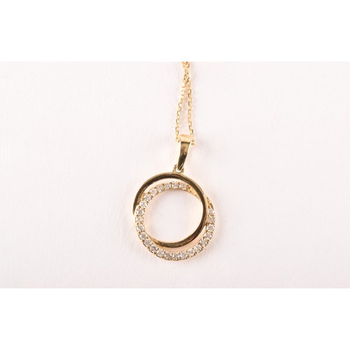 134 - A 9ct yellow gold and diamond double halo pendant, set with a diamond-set halo and a smooth gold hal... 