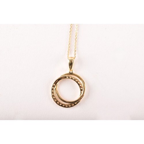 134 - A 9ct yellow gold and diamond double halo pendant, set with a diamond-set halo and a smooth gold hal... 