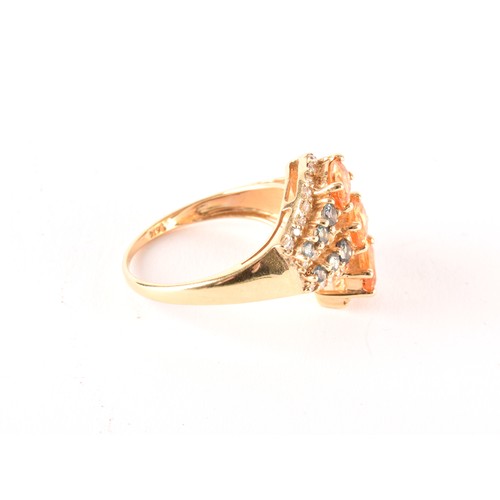 135 - A 14ct yellow gold, citrine, sapphire, and diamond crossover ring, set with three mixed oval-cut cit... 