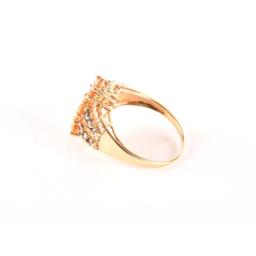 135 - A 14ct yellow gold, citrine, sapphire, and diamond crossover ring, set with three mixed oval-cut cit... 