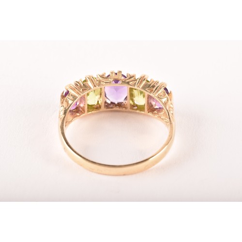 138 - A 9ct yellow gold, amethyst, and peridot ring, set with five alternating mixed oval-cut stones, size... 