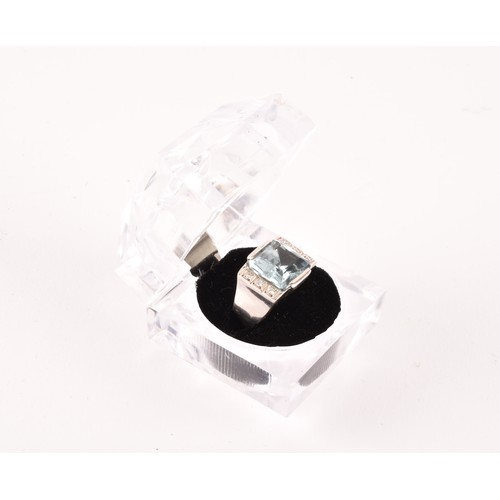 141 - A white gold, diamond, and aquamarine cocktail ring, in teh Art Deco style, set east to west with a ... 