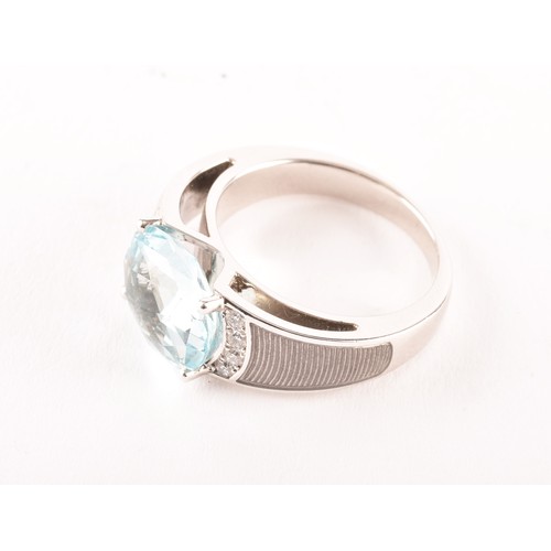 146 - A Victor Mayer 18ct white gold peacock ring, featuring a horizontally set oval checkerboard cut aqua... 