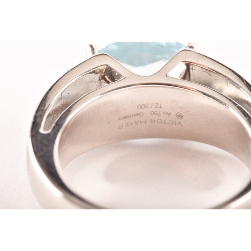 146 - A Victor Mayer 18ct white gold peacock ring, featuring a horizontally set oval checkerboard cut aqua... 