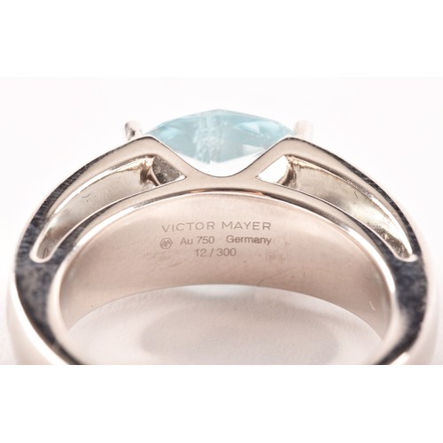 146 - A Victor Mayer 18ct white gold peacock ring, featuring a horizontally set oval checkerboard cut aqua... 