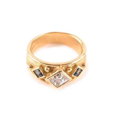 148 - An 18ct yellow gold Byzantine style ring, featuring a rectangular princess-cut diamond set on its ax... 