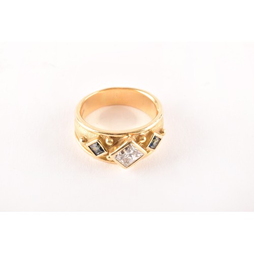 148 - An 18ct yellow gold Byzantine style ring, featuring a rectangular princess-cut diamond set on its ax... 