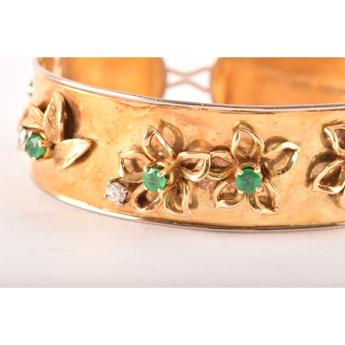 149 - An 18ct yellow gold bangle, set with eight round emeralds with an approximate combined weight of 0.8... 