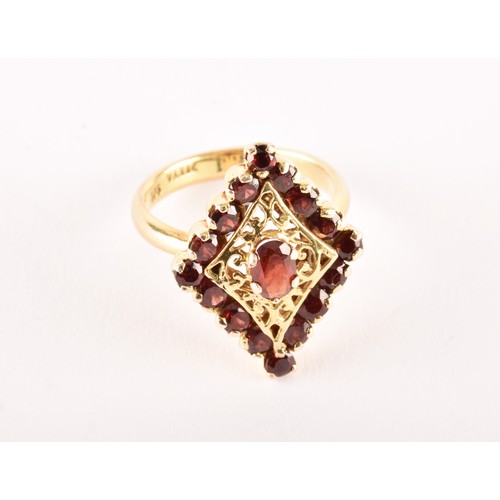 152 - A 9ct yellow gold marquise shape cluster ring set to centre with an oval garnet surrounded by sixtee... 