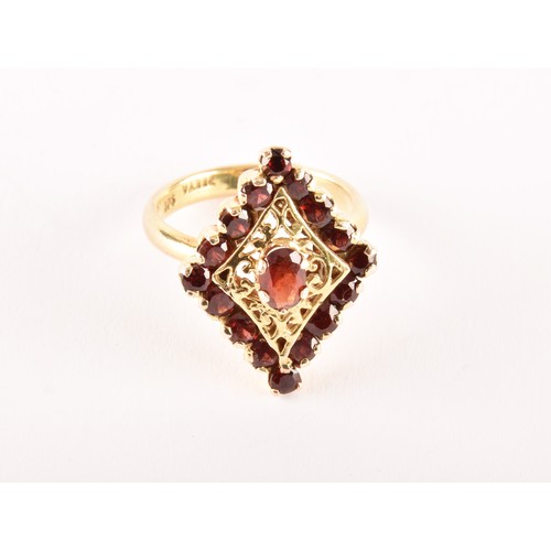 152 - A 9ct yellow gold marquise shape cluster ring set to centre with an oval garnet surrounded by sixtee... 