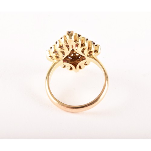 152 - A 9ct yellow gold marquise shape cluster ring set to centre with an oval garnet surrounded by sixtee... 